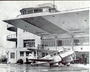 Elmdon Airport with a Bi-Plane waiting to take passengers on board.